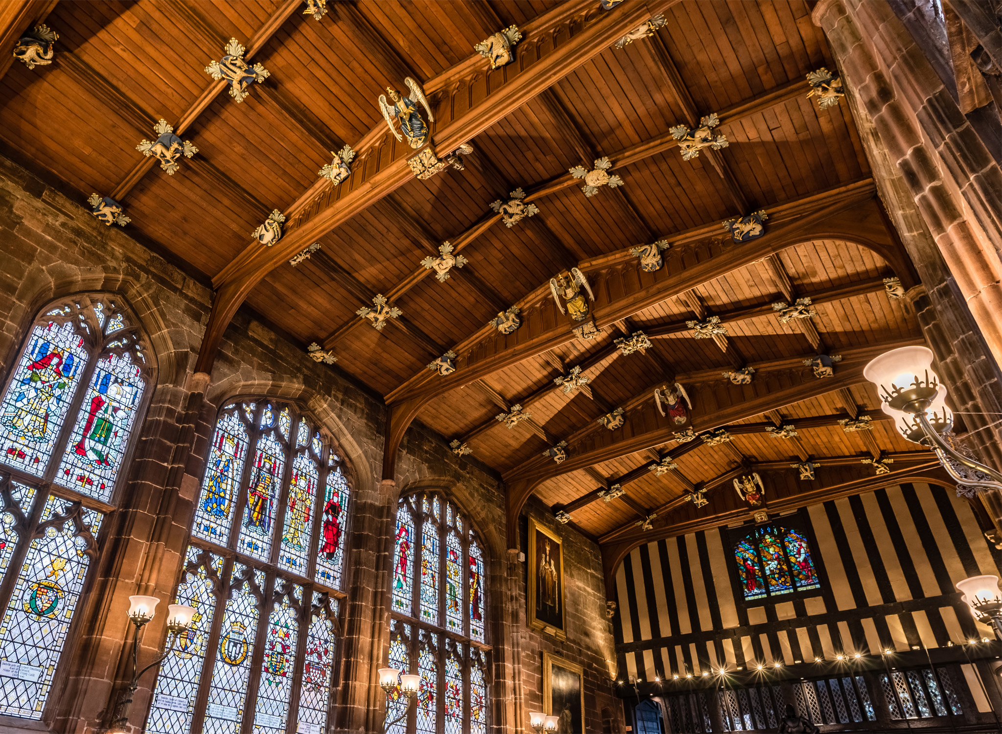 Stained windows and church ceiling inside St Mary's Guildhall.